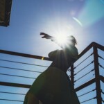 Ai Yin Adelski dancing on a fire escape.