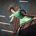 Ai Yin Adelski dancing on a fire escape.