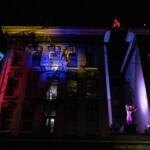 Sonsherée Giles, Jhia Jackson, and MaryStarr Hope dancing on the side of the Cadillac Hotel.