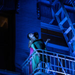 Ai Yin Adelski and Laura Elaine Ellis dancing on the side of the Cadillac Hotel.