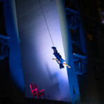 Megan Lowe dancing on the side of the Cadillac Hotel