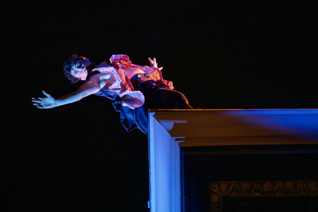 B Dean dancing on a roof top.