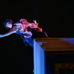 B Dean dancing on a roof top.