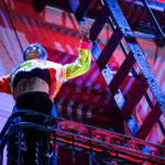 Ai Yin Adelski dancing on a fire escape.