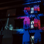 Quinn Dior and Gabriele Christian dancing on a fire escape.