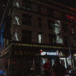 Video projection on the side of a building